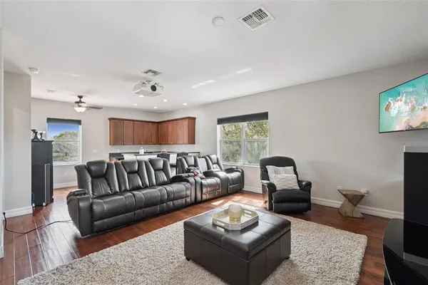 a living room with furniture and a rug