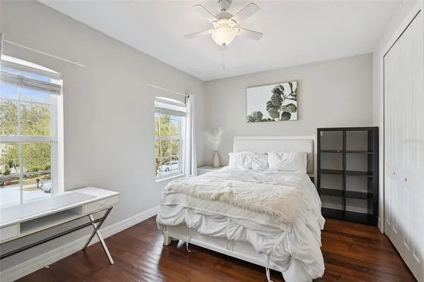 a bedroom with a bed and a table