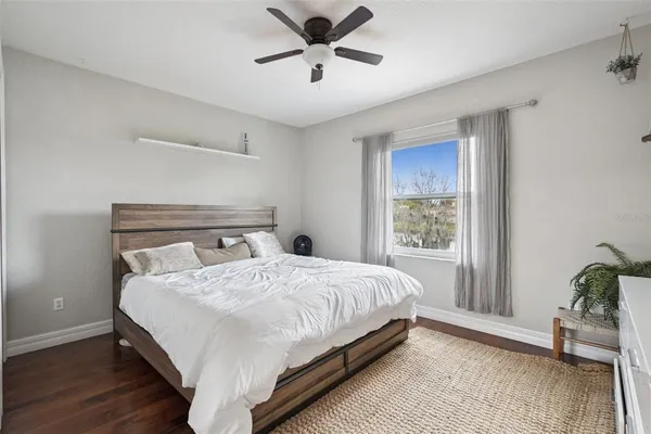 a bedroom with a bed and window
