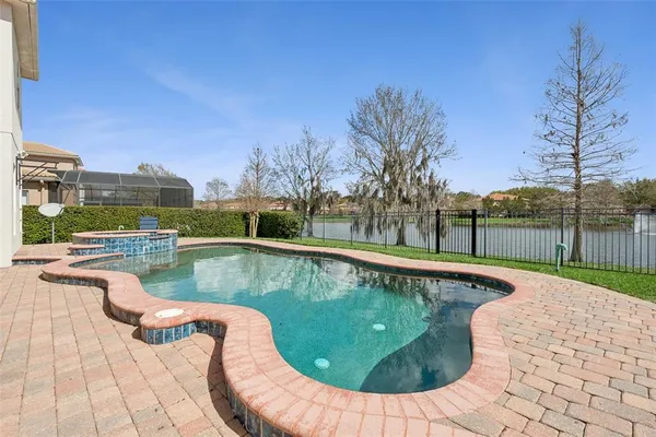 a view of a swimming pool with a lounge chair