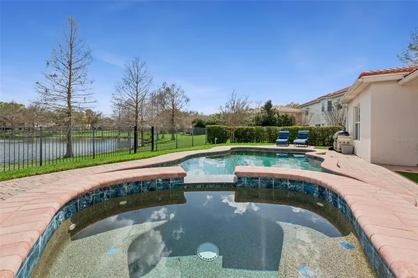 a view of swimming pool with a patio
