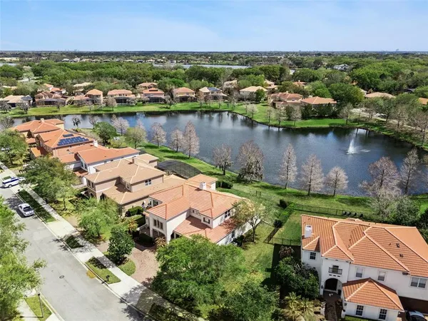 an aerial view of a house with a lake view