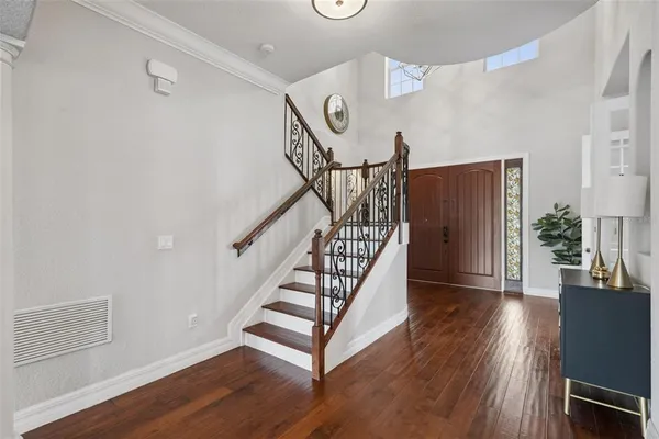 a view of entryway with wooden floor