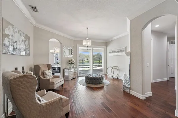 a living room with furniture rug and a large window