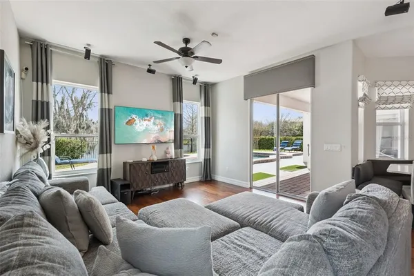 a living room with furniture and a large window