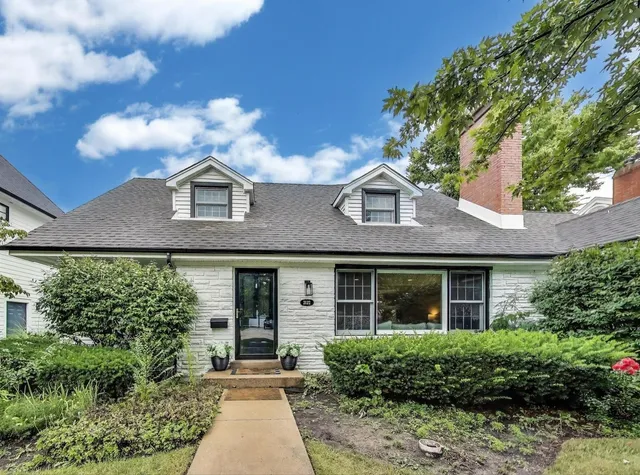 a front view of a house with yard