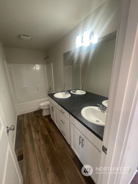 2802 Laurel (lot 4) Loop Milton, WA 98354 - Photo 14 of 18 a bathroom with a double vanity sink and mirror