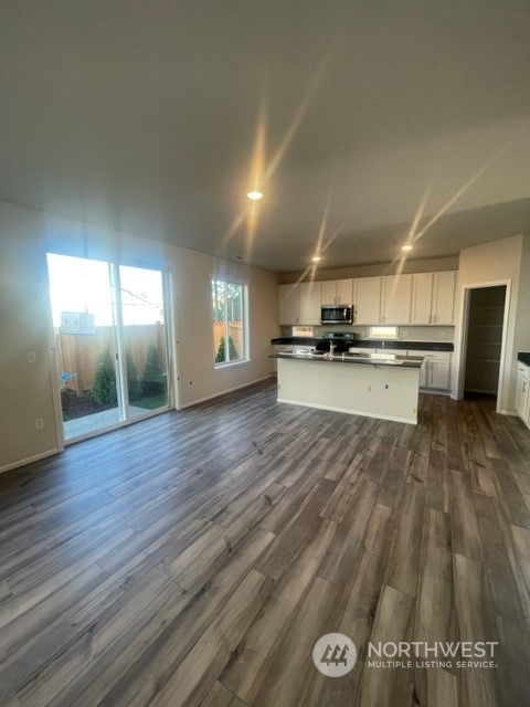 2802 Laurel (lot 4) Loop Milton, WA 98354 - Photo 5 of 18 a view of a kitchen with a sink wooden floor and cabinets