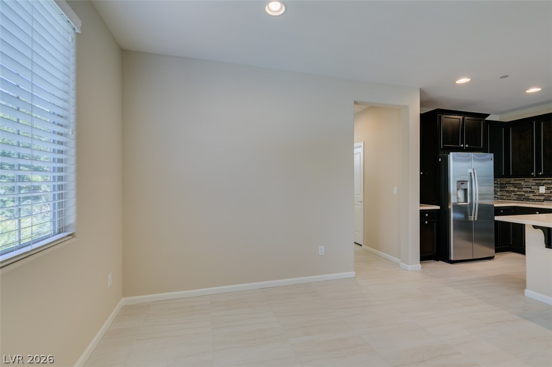 2549 Sable Ridge Street Henderson, NV 89044 - Photo 20 of 48 A well-lit living area with clean lines, featuring a clear view to the modern kitchen.