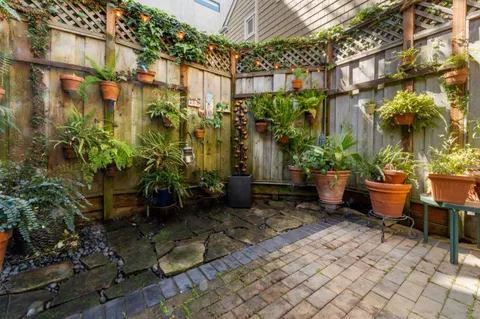 a garden with view of a building