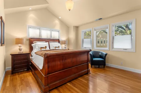 a bedroom with bed and window