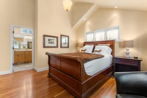 a bedroom with a bed and window