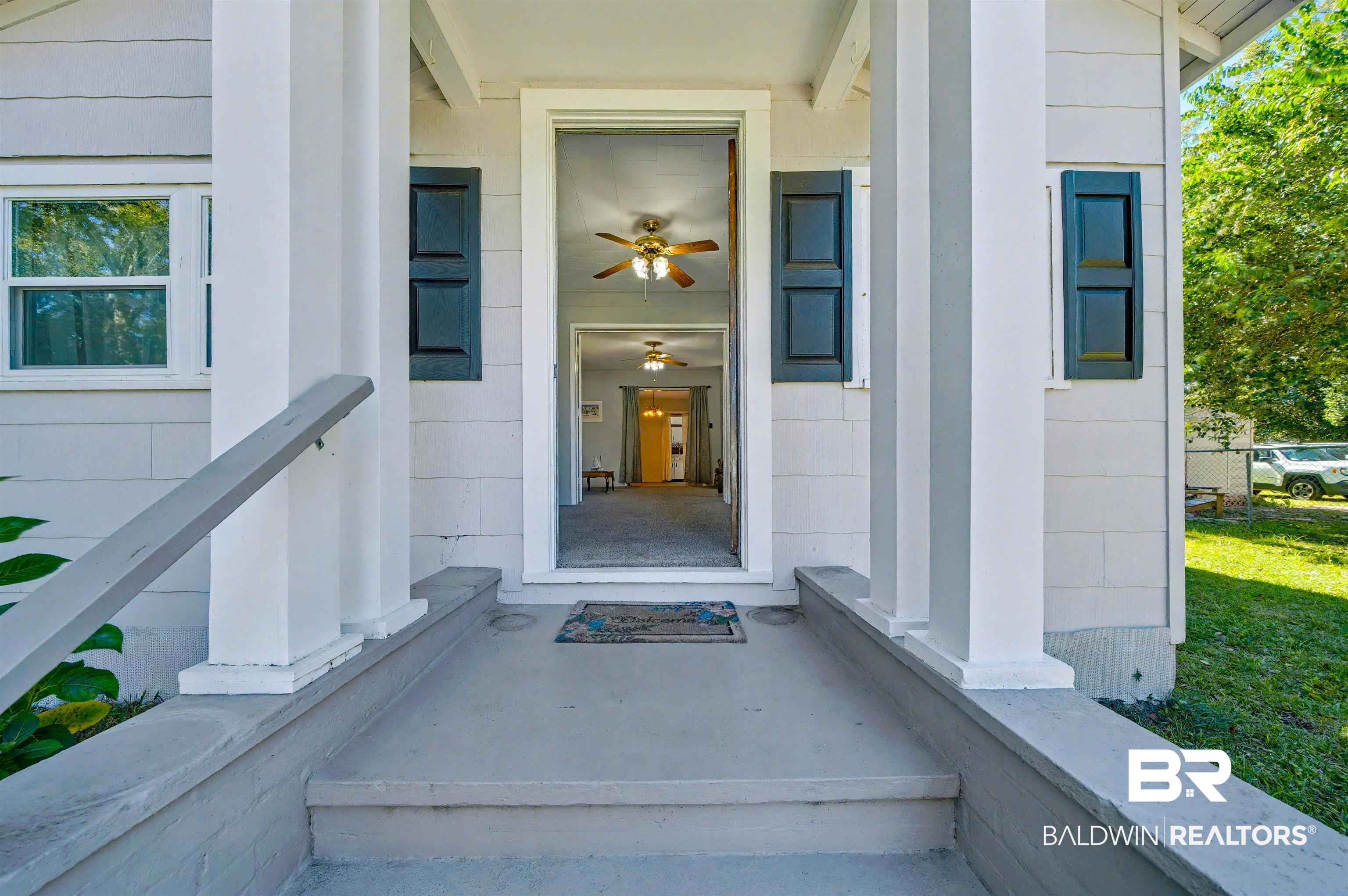 209 West Magnolia Avenue Foley, AL 36535 - Photo 5 of 23 Entrance to property with a porch