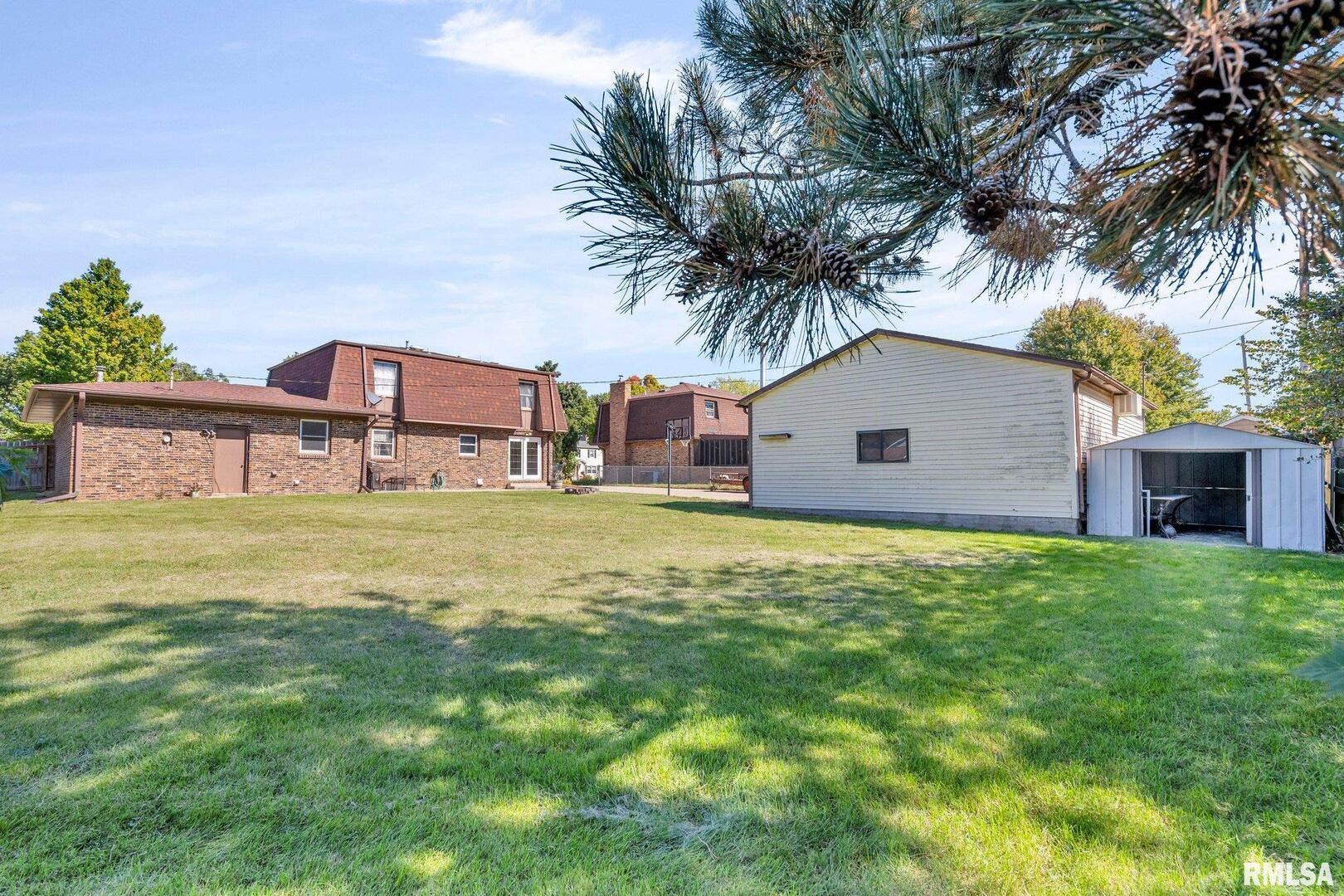 107 Hilltop Street Colona, IL 61241 - Photo 24 of 25 a house view with a garden space