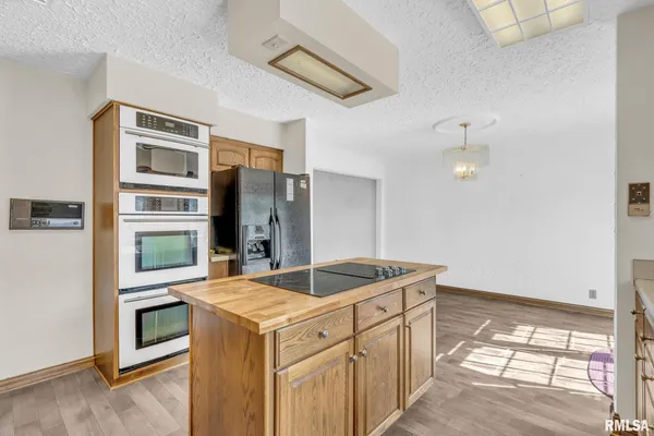 a kitchen with a stove and a sink