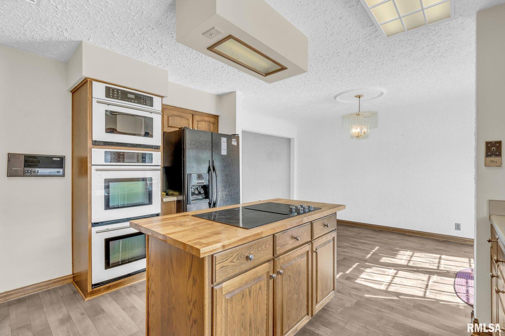 107 Hilltop Street Colona, IL 61241 - Photo 8 of 25 a kitchen with a stove and a sink