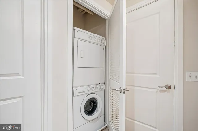 a view of a hallway with washer and dryer