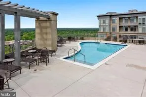 a view of a patio with a table and chairs