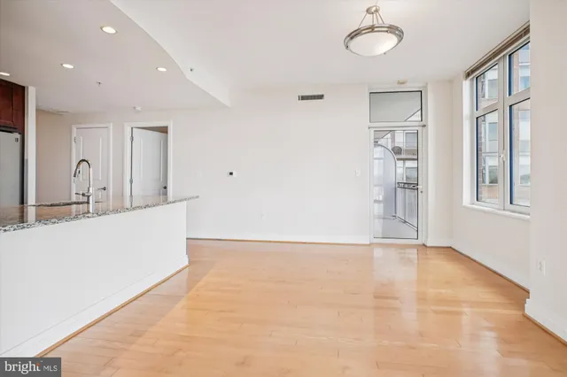 a view of a kitchen with a sink and cabinet area