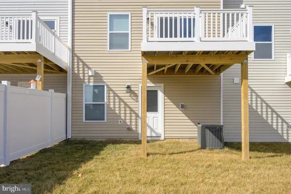 a view of a balcony with wooden fence