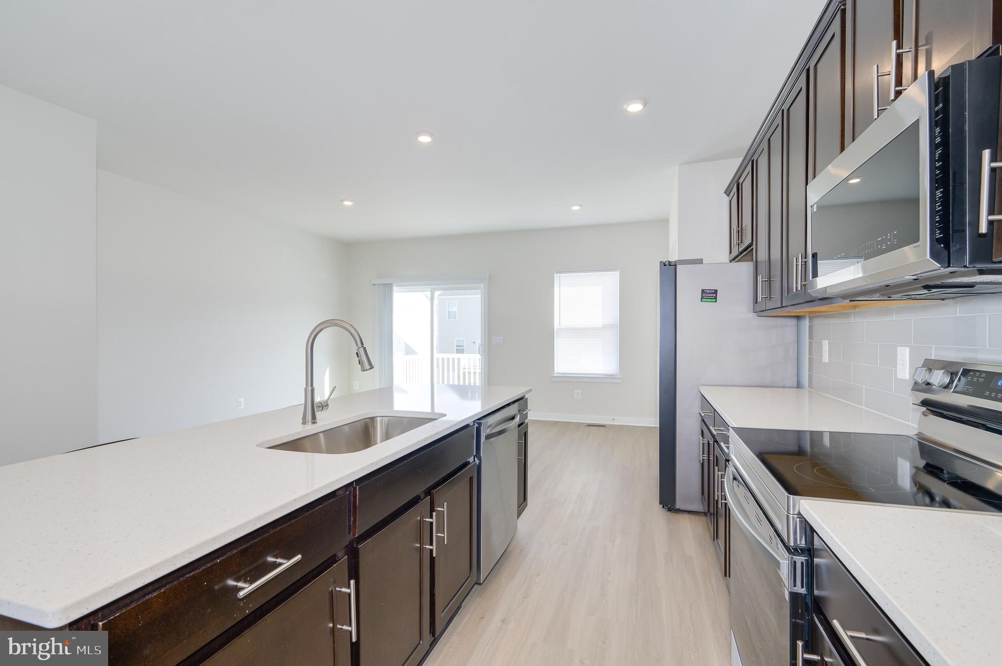 14 Trotting Road Inwood, WV 25428 - Photo 28 of 53 a kitchen with a sink stove and cabinets