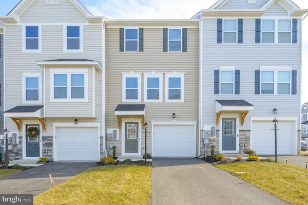 a view of a brick building with many windows