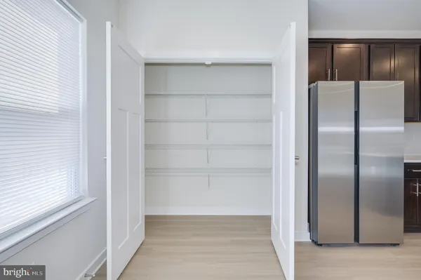 a bathroom with a sink a mirror and shower