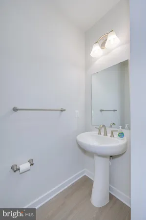 a view of a hallway with an entryway door