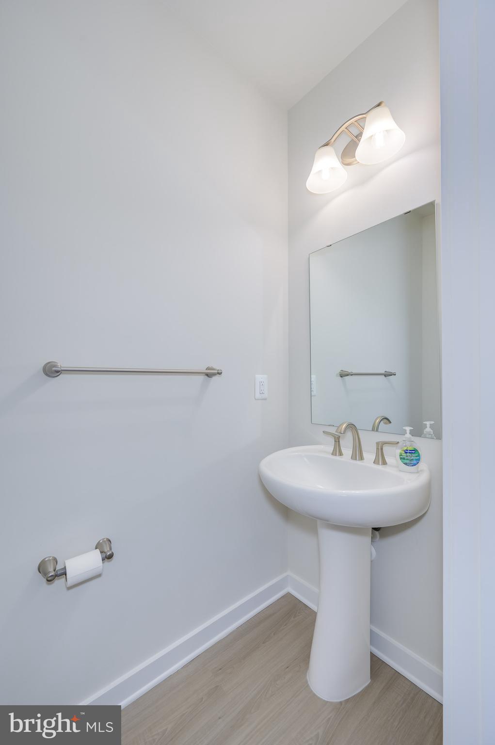 14 Trotting Road Inwood, WV 25428 - Photo 38 of 53 a bathroom with a sink a mirror and shower