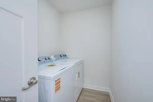 a view of an empty room and closet area