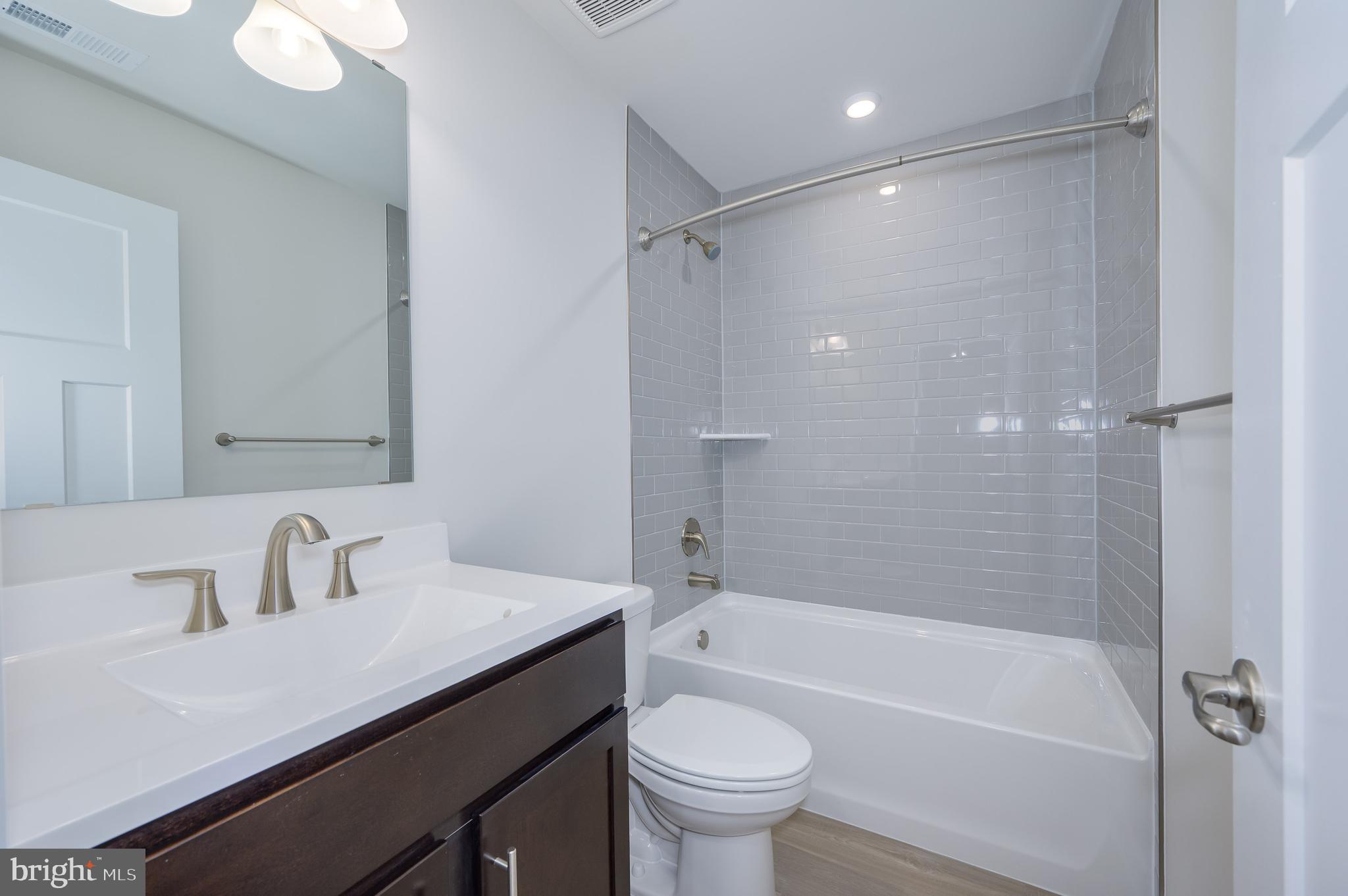 14 Trotting Road Inwood, WV 25428 - Photo 49 of 53 a bathroom with a sink a toilet and a bathtub