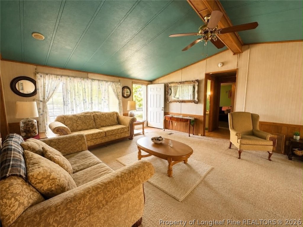 4435 Tartt's Mill Road Wilson, NC 27893 - Photo 5 of 23 a living room with furniture and a wooden floor