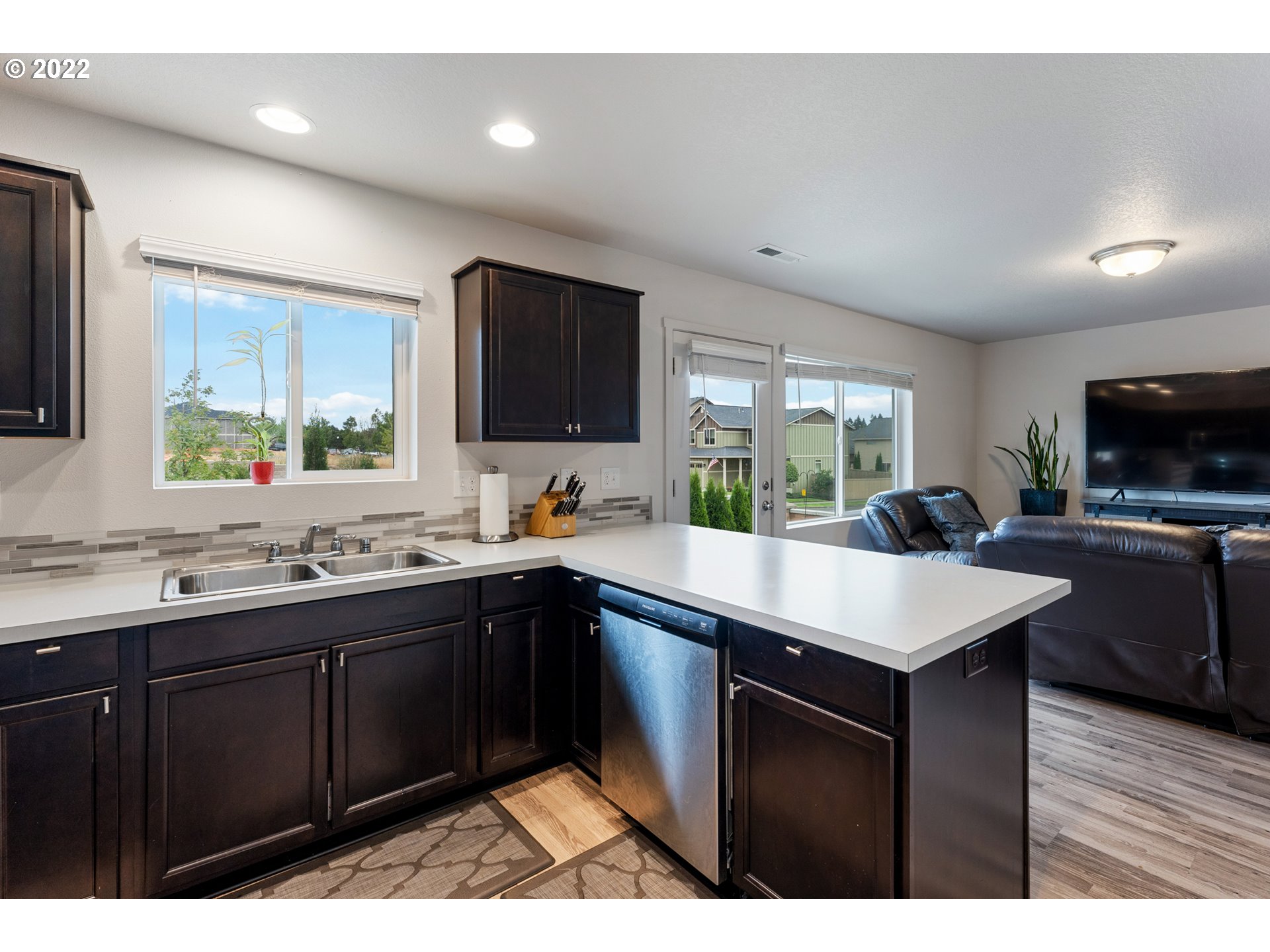 2256 South Meadowlark Dr. Ridgefield, WA 98642 - Photo 11 of 32 a kitchen with a sink a counter top space appliances and cabinets