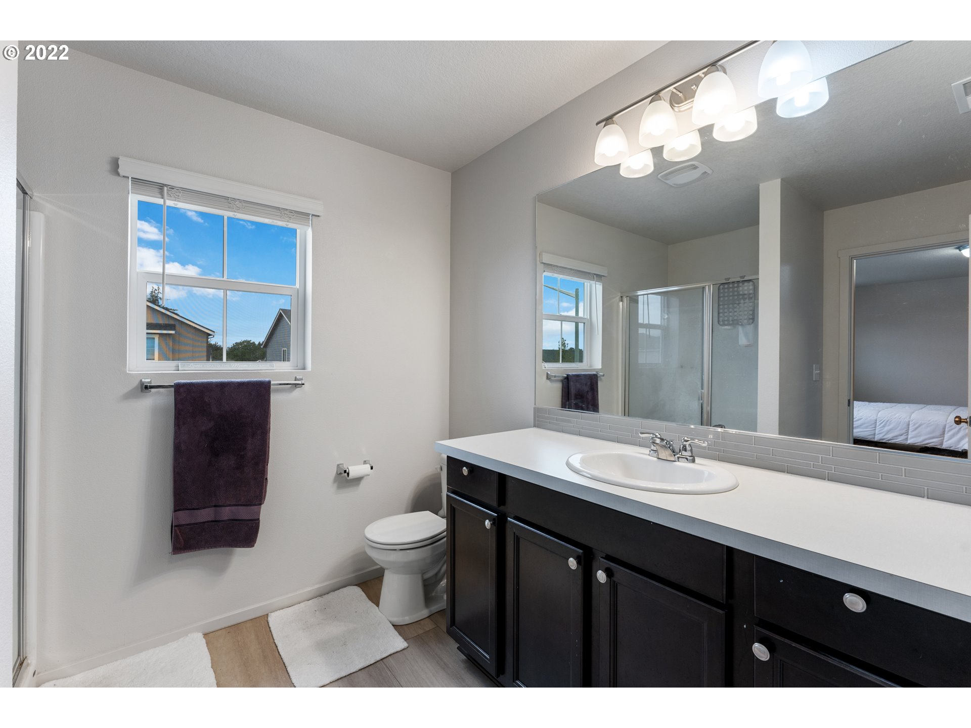 2256 South Meadowlark Dr. Ridgefield, WA 98642 - Photo 19 of 32 a bathroom with a sink a toilet and a mirror
