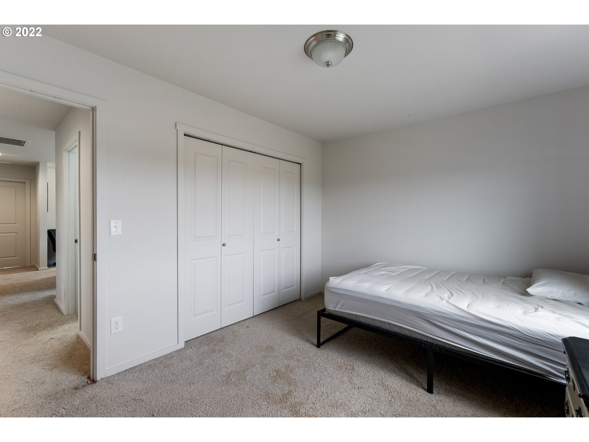 2256 South Meadowlark Dr. Ridgefield, WA 98642 - Photo 25 of 32 a bedroom with a bed and a table