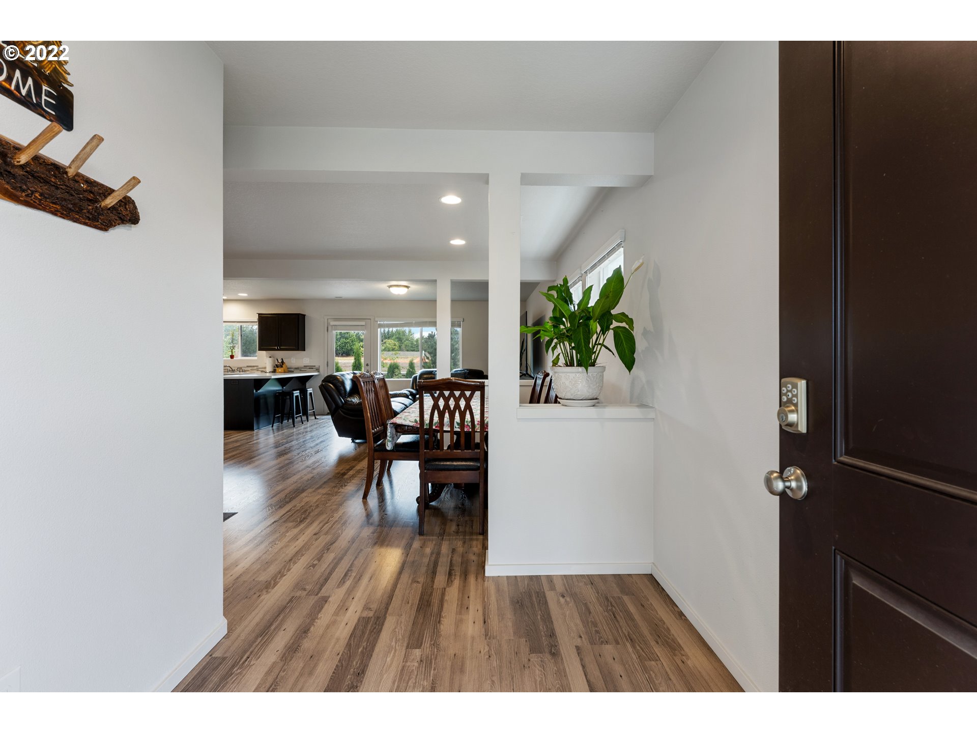 2256 South Meadowlark Dr. Ridgefield, WA 98642 - Photo 3 of 32 a view of a dining room with furniture and wooden floor