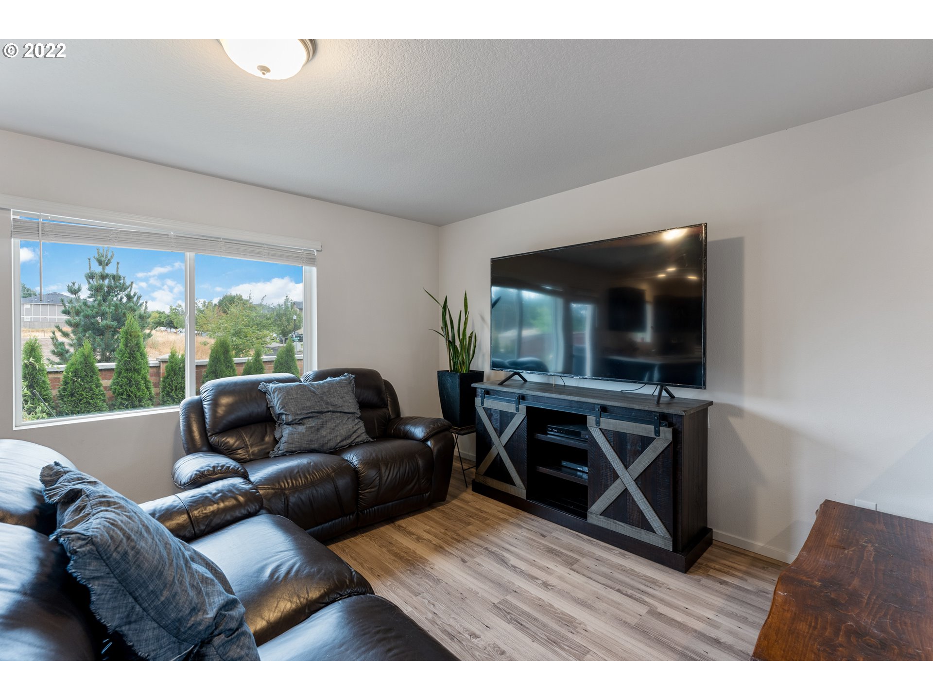 2256 South Meadowlark Dr. Ridgefield, WA 98642 - Photo 8 of 32 a living room with furniture and a wooden floor