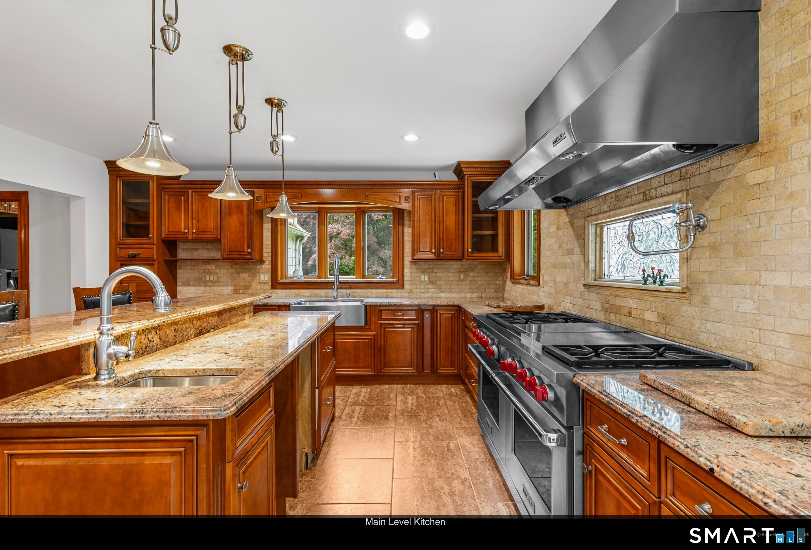 190 East Rocks Road Norwalk, CT 06851 - Photo 12 of 38 a kitchen with stainless steel appliances granite countertop a stove a sink and a wooden cabinets