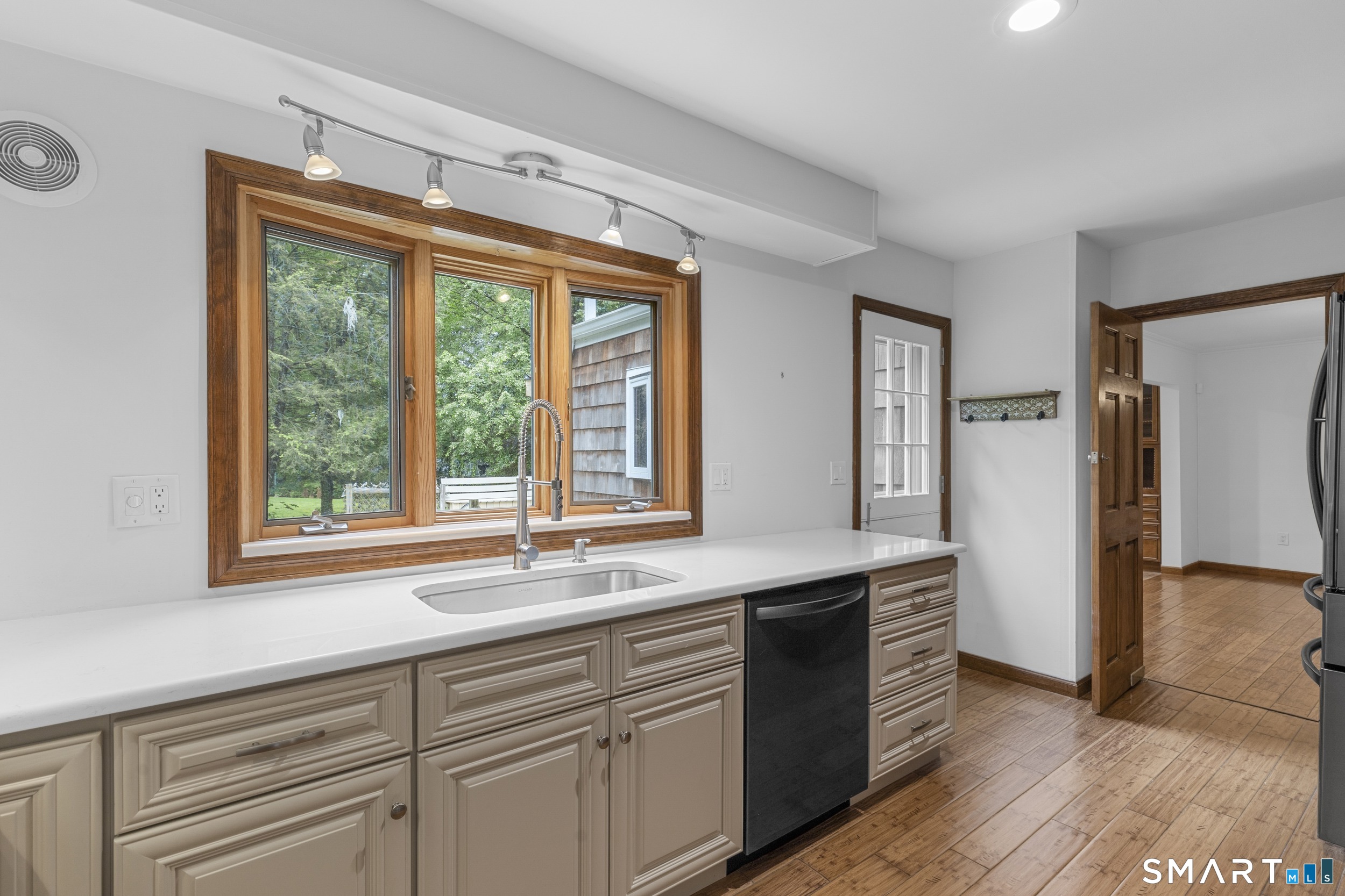 190 East Rocks Road Norwalk, CT 06851 - Photo 17 of 38 a kitchen with granite countertop a sink and a window