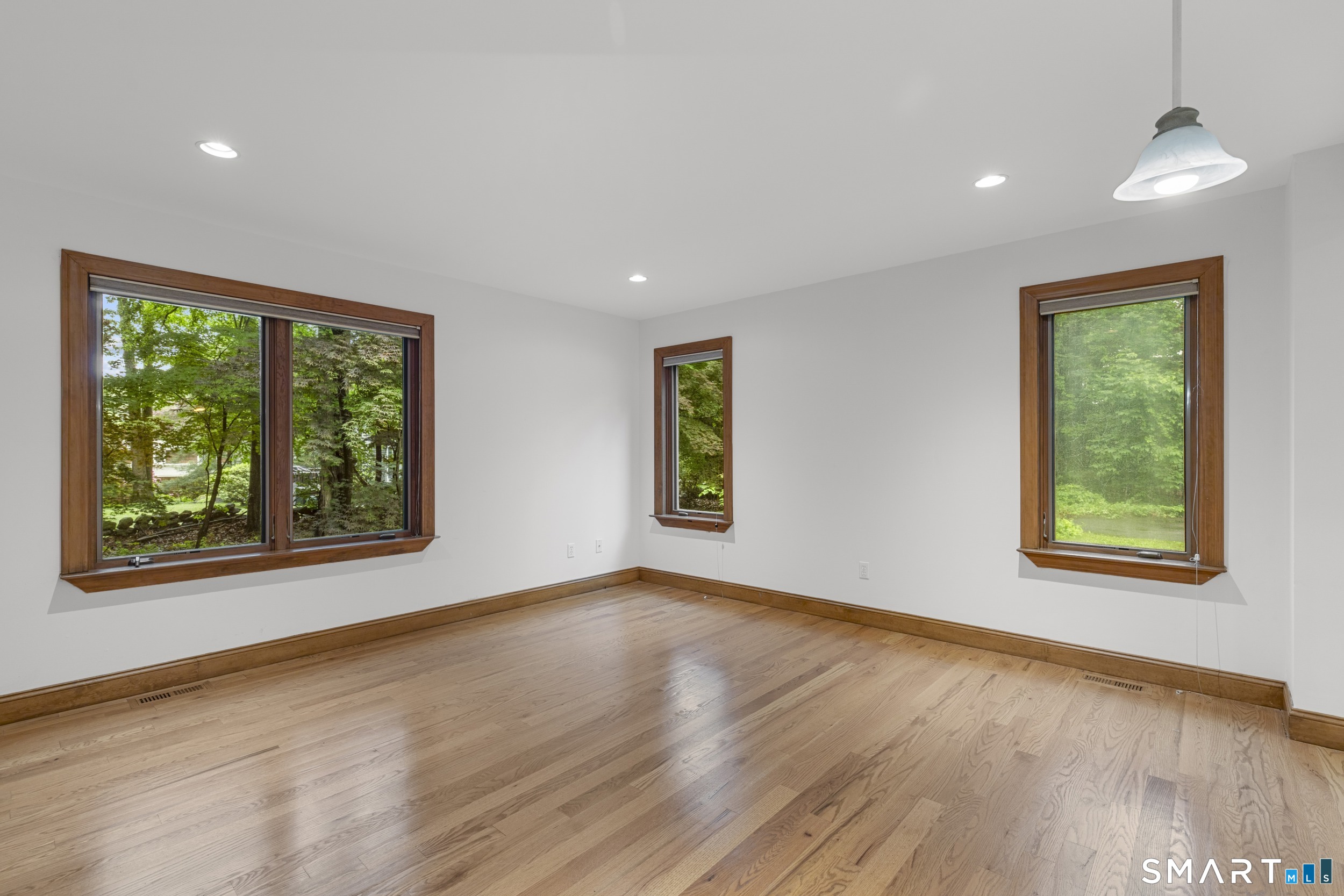 190 East Rocks Road Norwalk, CT 06851 - Photo 19 of 38 a view of an empty room with wooden floor and a window