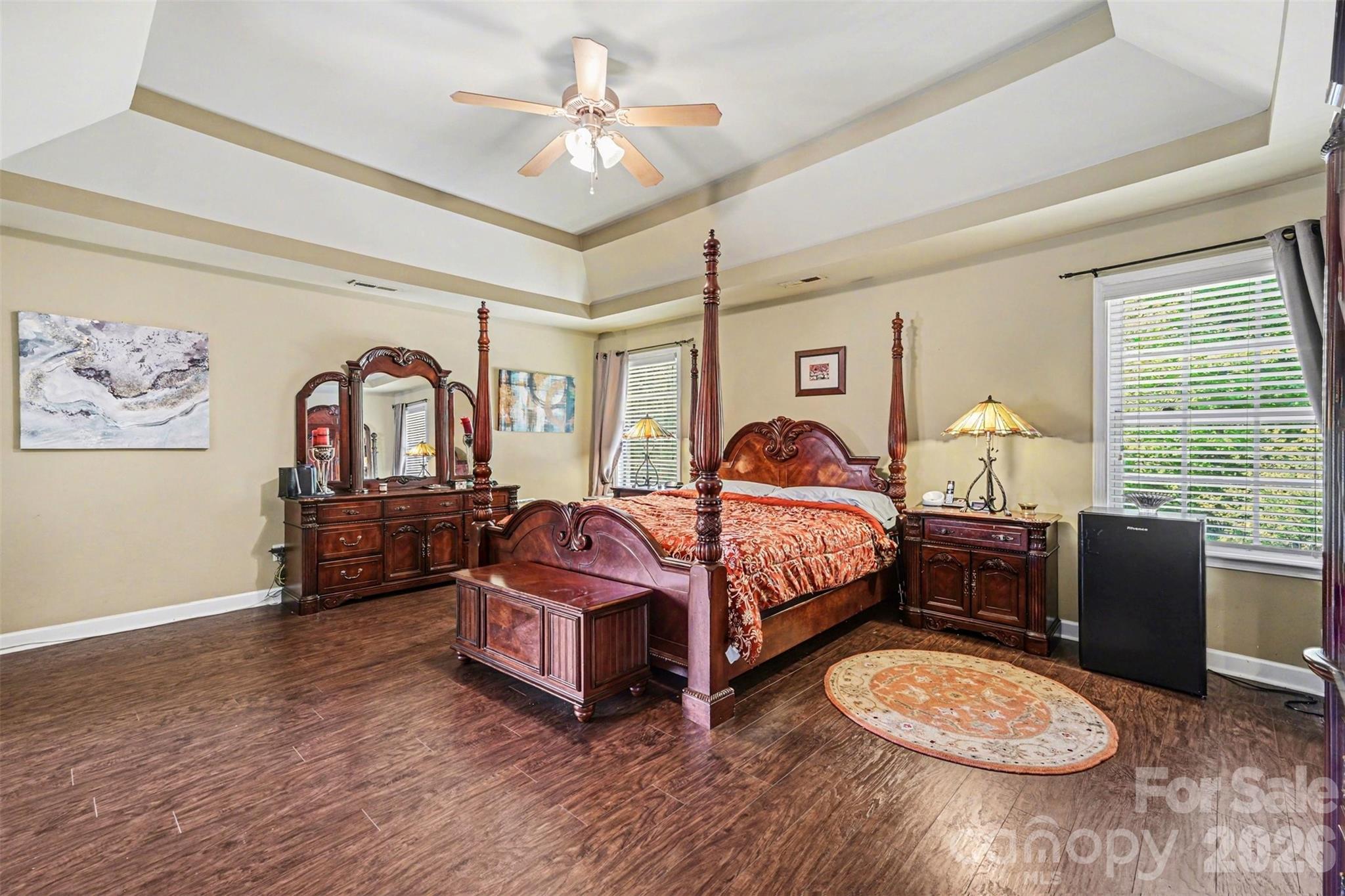 10812 Clark Street Davidson, NC 28036 - Photo 14 of 32 a bedroom with a bed and wooden floor