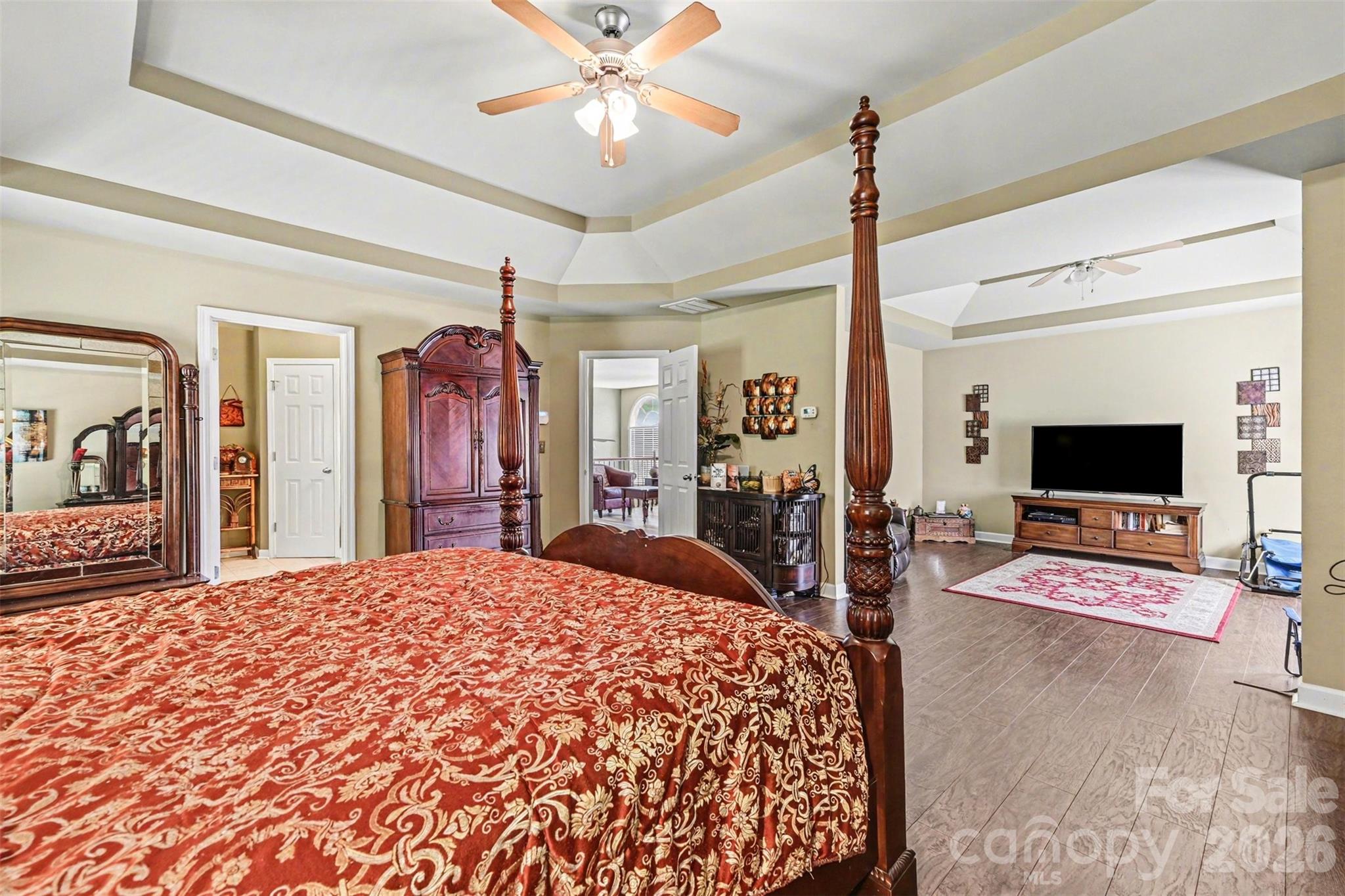 10812 Clark Street Davidson, NC 28036 - Photo 15 of 32 a bedroom with a bed and a flat screen tv