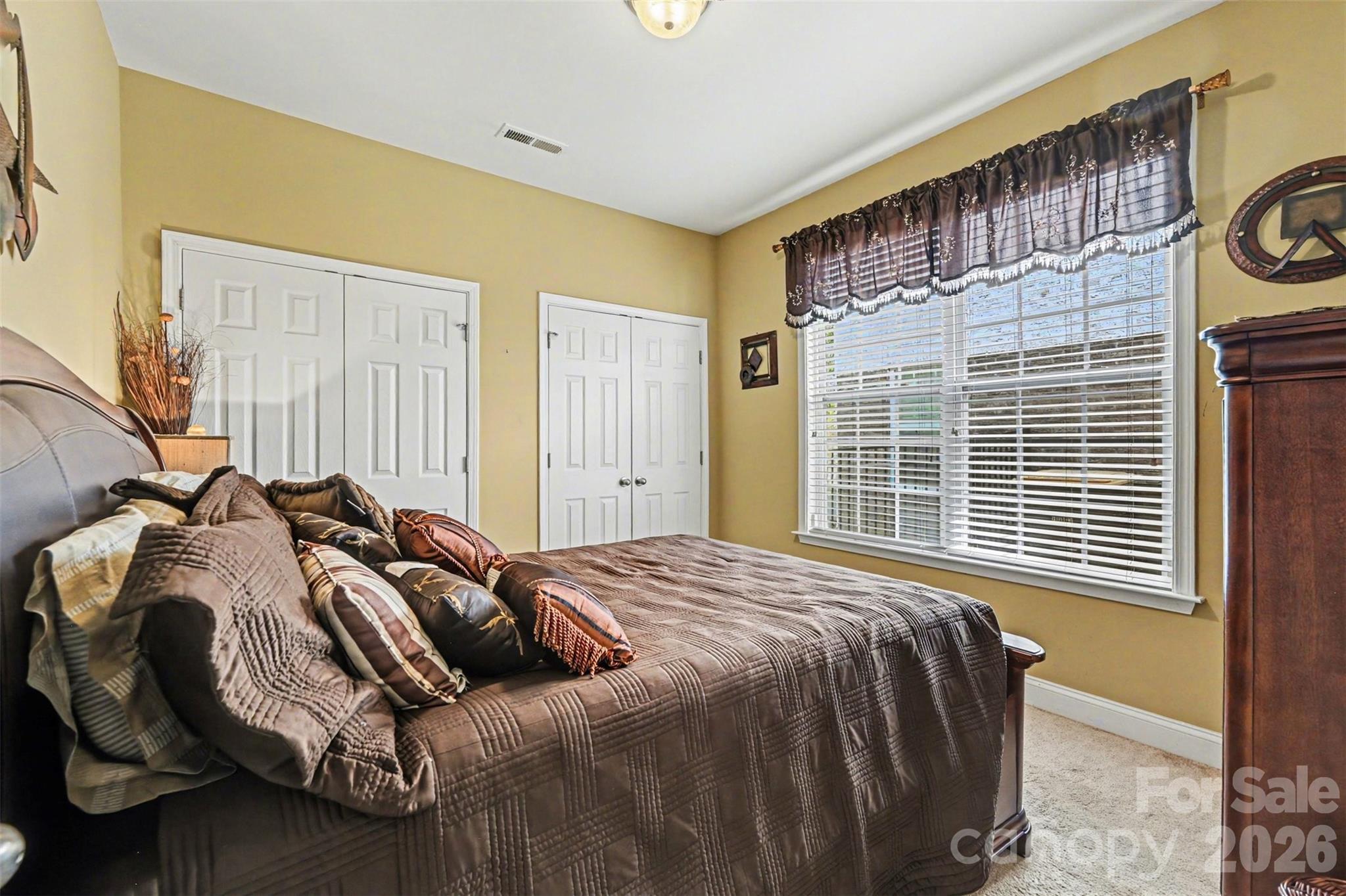 10812 Clark Street Davidson, NC 28036 - Photo 20 of 32 a bedroom with a bed and a window