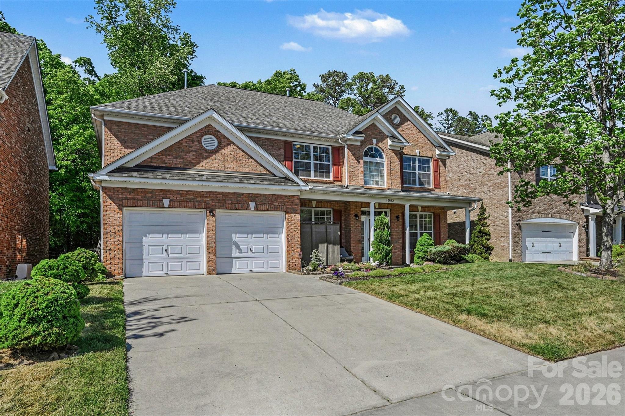 10812 Clark Street Davidson, NC 28036 - Photo 2 of 32 a front view of a house with a yard