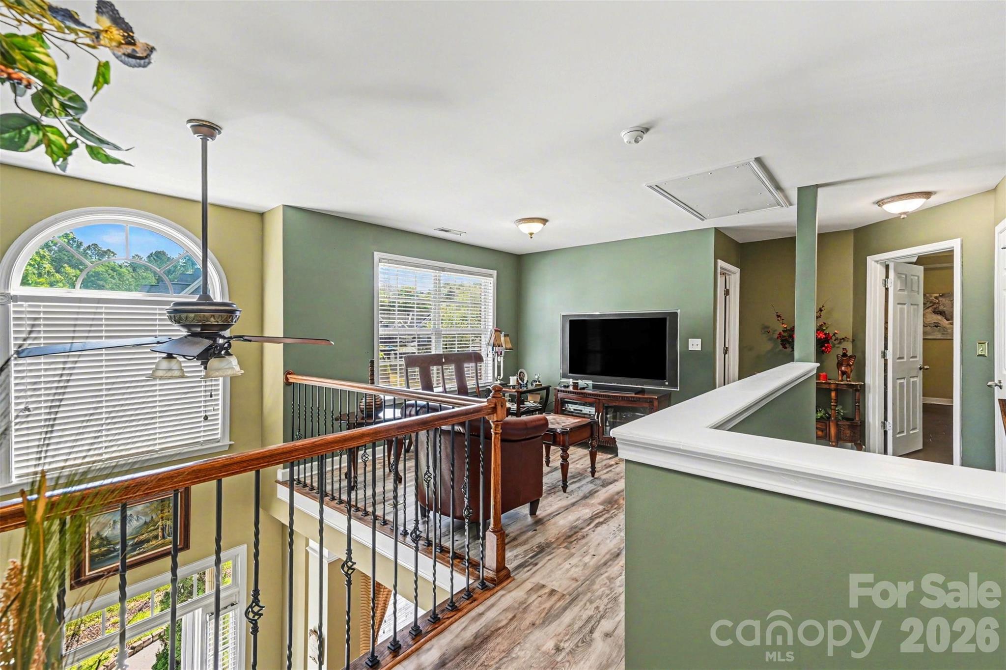 10812 Clark Street Davidson, NC 28036 - Photo 21 of 32 a view of living room with furniture and flat screen tv
