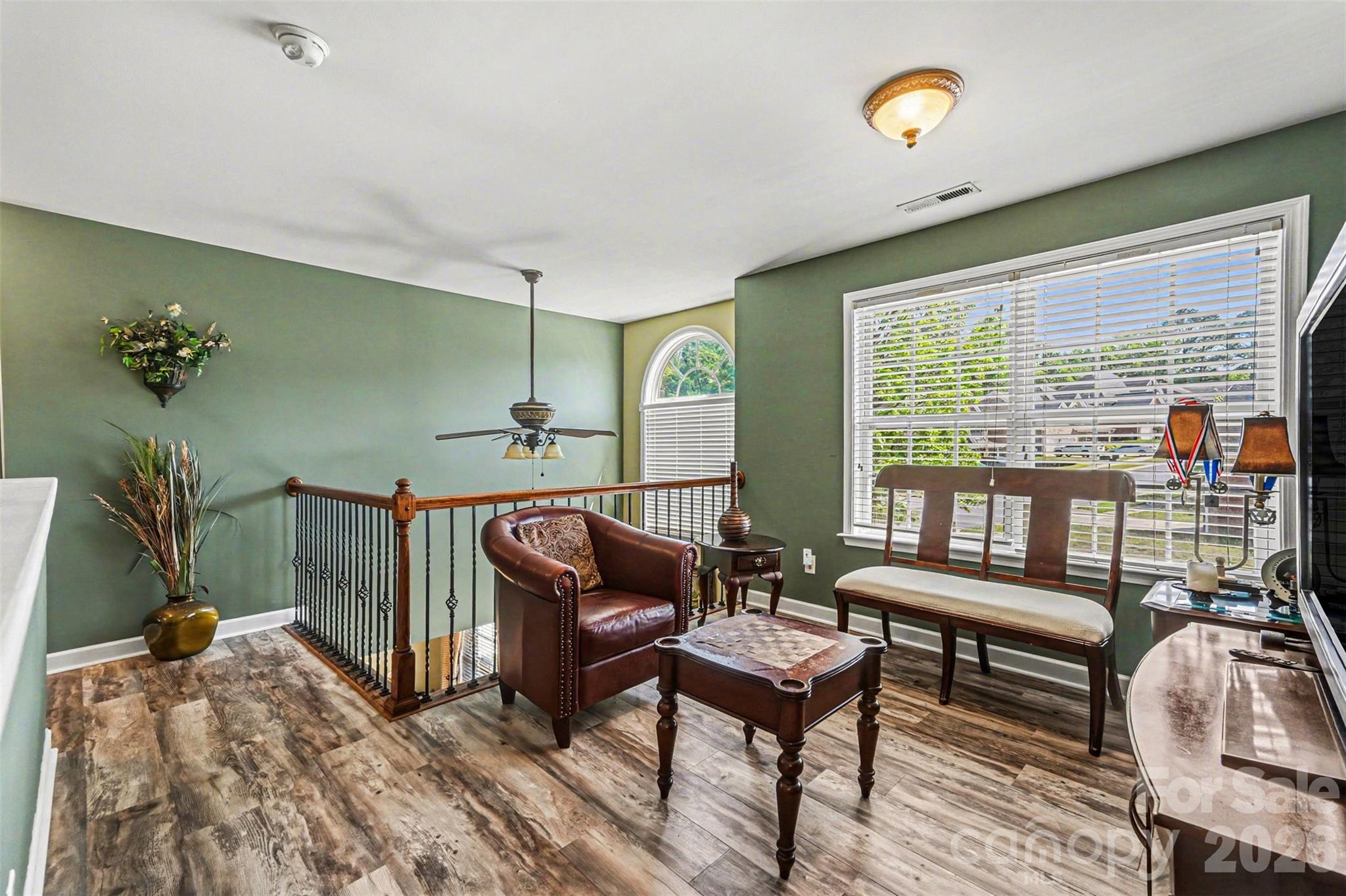 10812 Clark Street Davidson, NC 28036 - Photo 22 of 32 a reading room with furniture and a floor to ceiling window