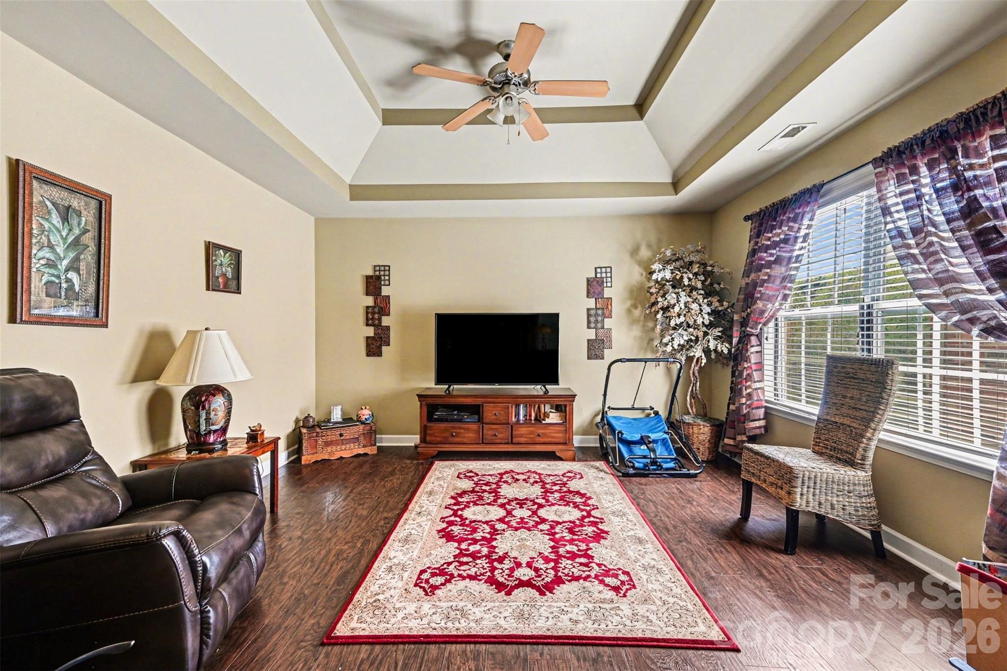 10812 Clark Street Davidson, NC 28036 - Photo 23 of 32 a living room with furniture and a flat screen tv
