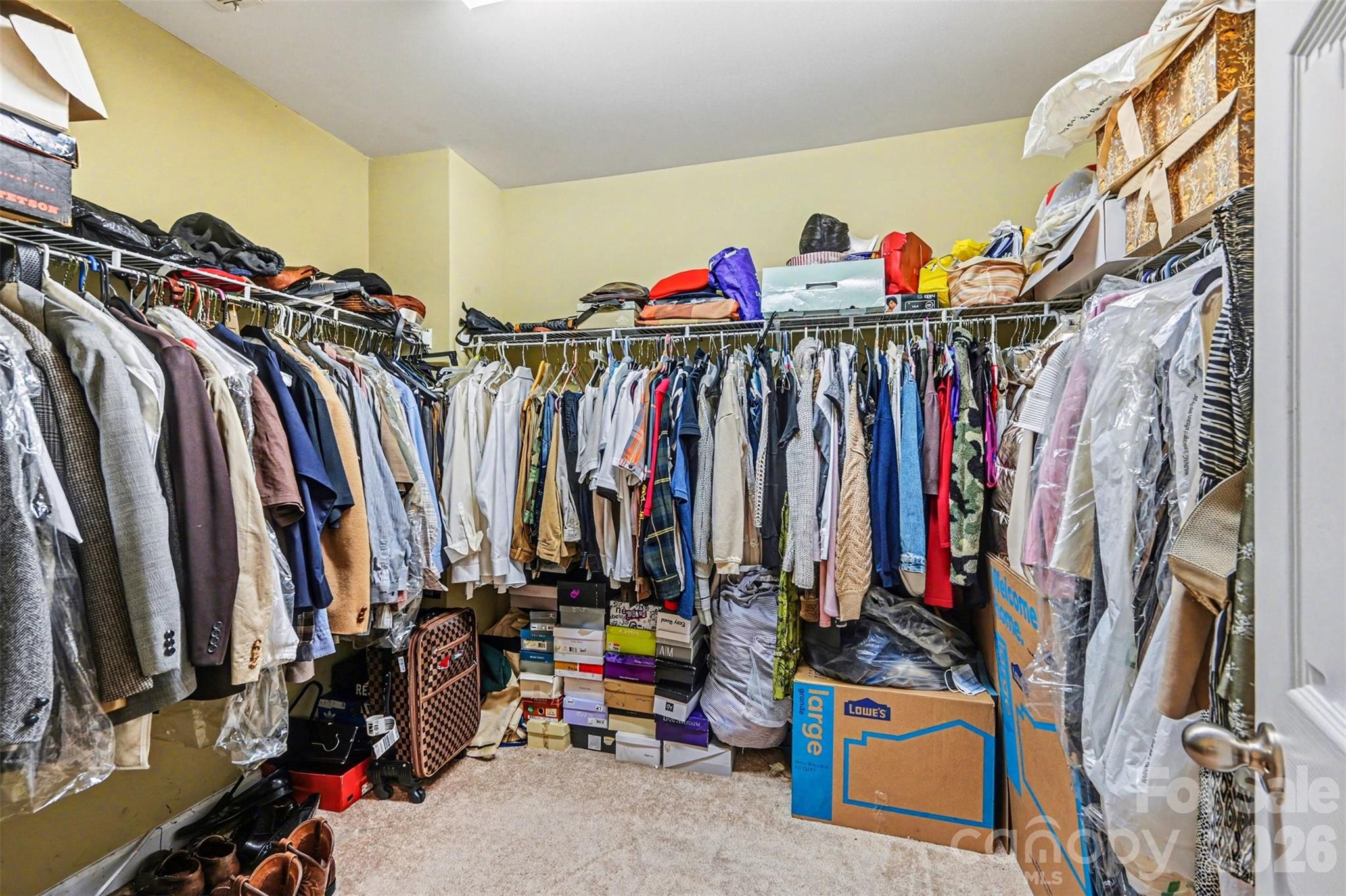 10812 Clark Street Davidson, NC 28036 - Photo 28 of 32 a view of walk in closet with clothes