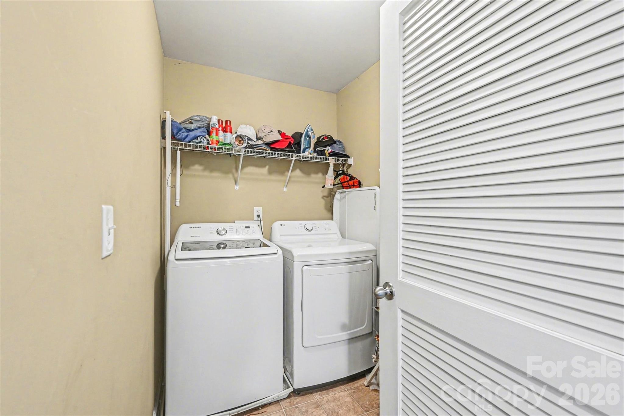 10812 Clark Street Davidson, NC 28036 - Photo 29 of 32 a utility room with dryer and washer