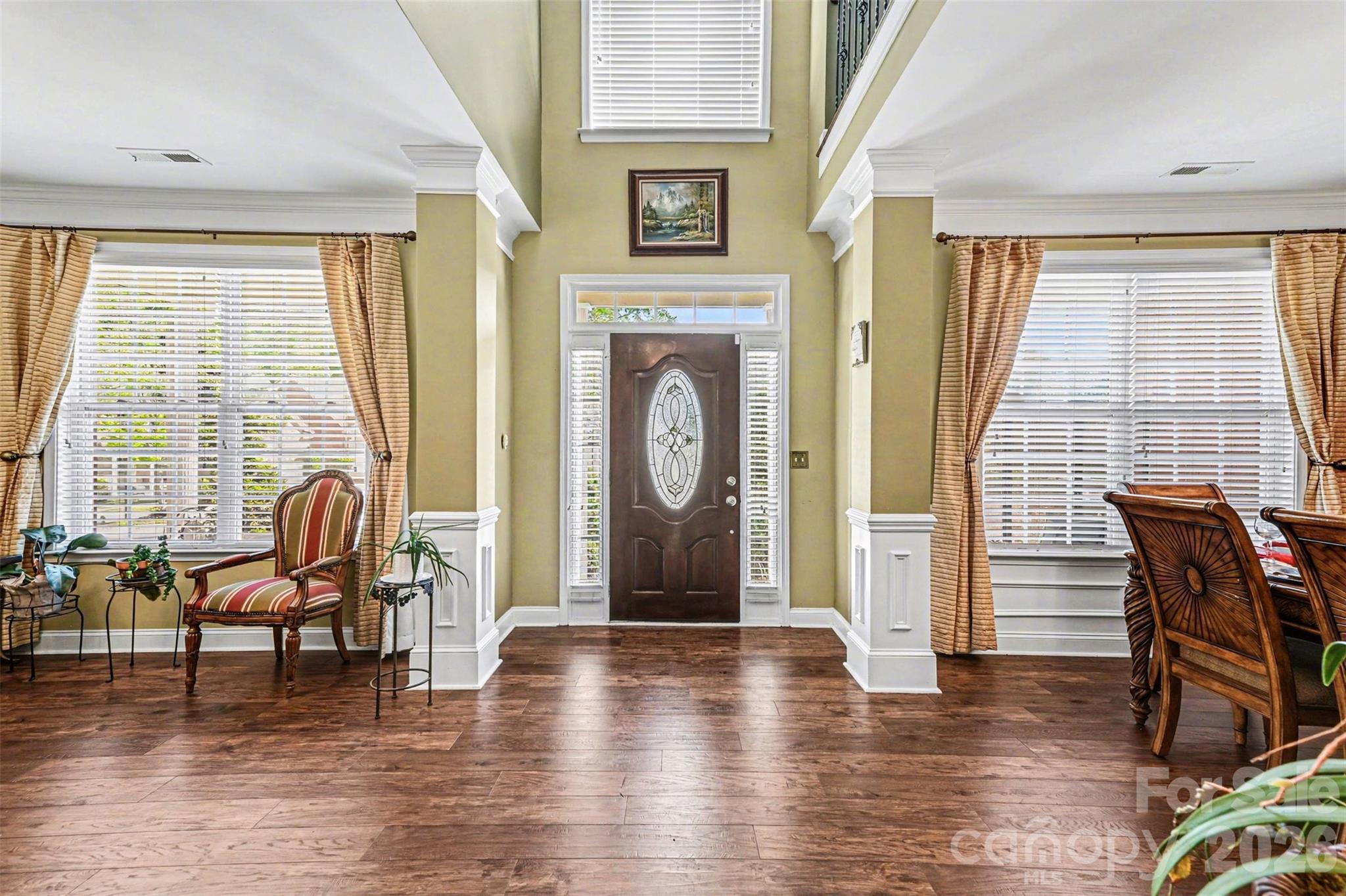 10812 Clark Street Davidson, NC 28036 - Photo 6 of 32 a view of livingroom with furniture window and front door